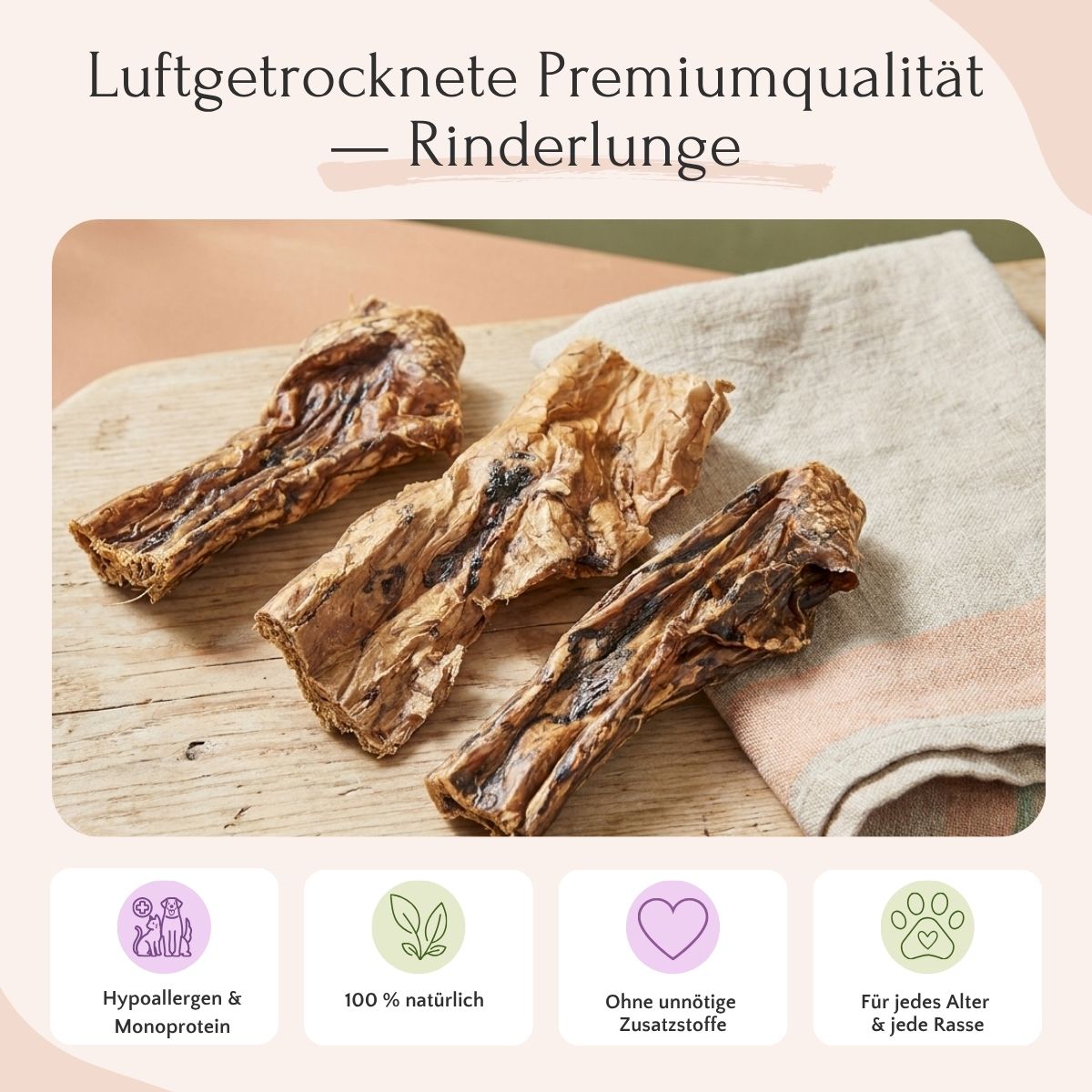 Drei Stück Rinderlunge (900 g) von FAVLY Petfood auf Stoff, mit deutschem Text und vier Symbolen für Kauspielzeug.