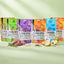 Sechs Packungen FAVLY Probierpaket "Snack it" von FAVLY Petfood mit Fleisch, Kräutern, Banane & Birne vorne.
